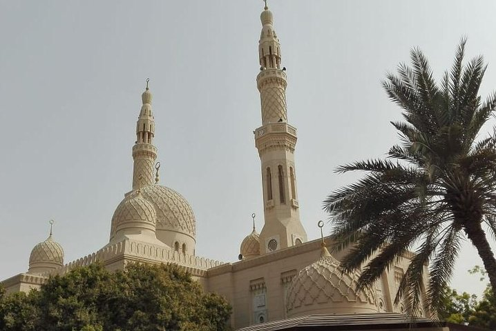 Experience the stunning blend of modernity and tradition with striking architecture and lush palm trees showcasing Dubai's rich cultural tapestry during this half-day city tour.